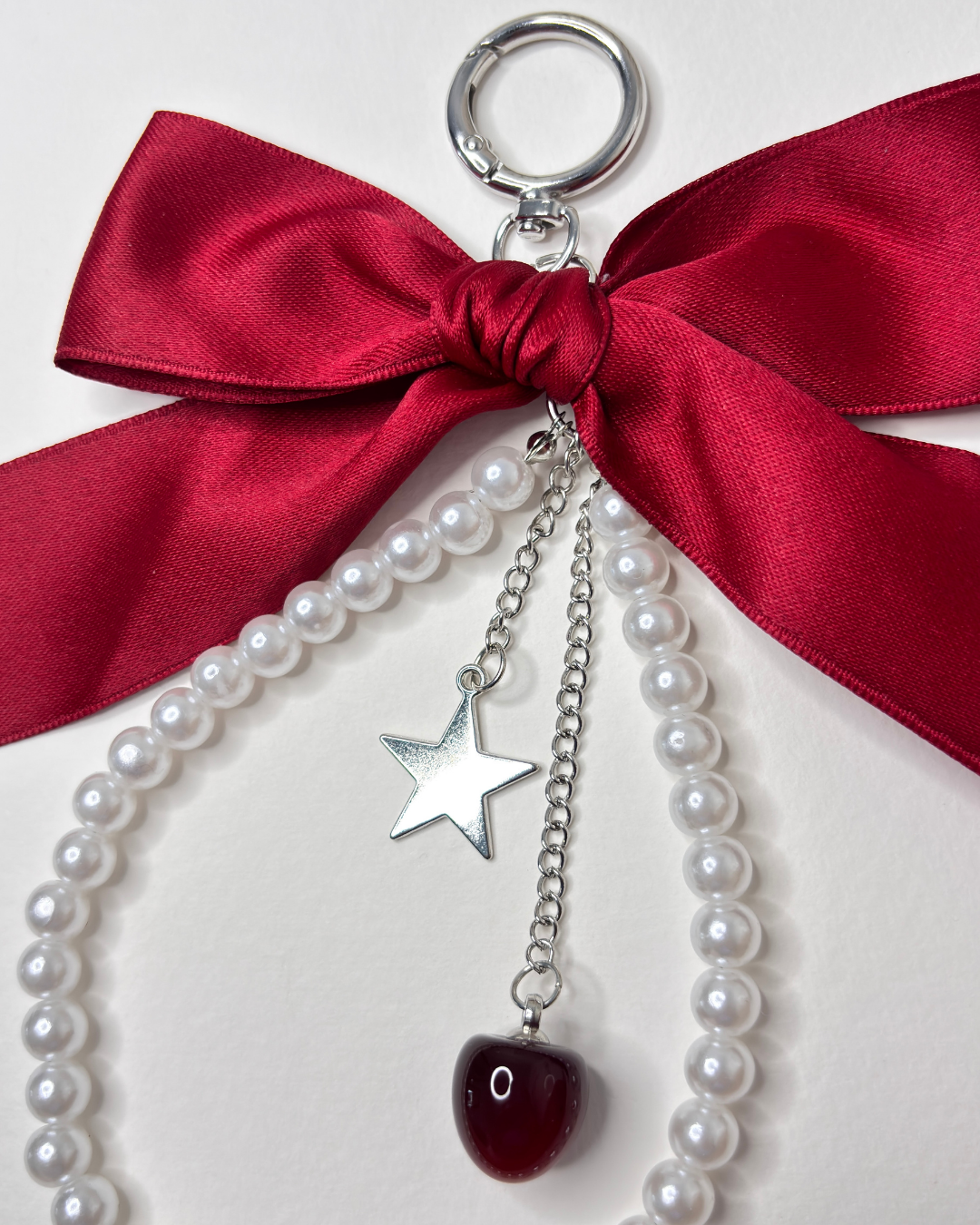 Dark Cherry Decoded — Burgundy Bow Pearl Cherry Star Charm